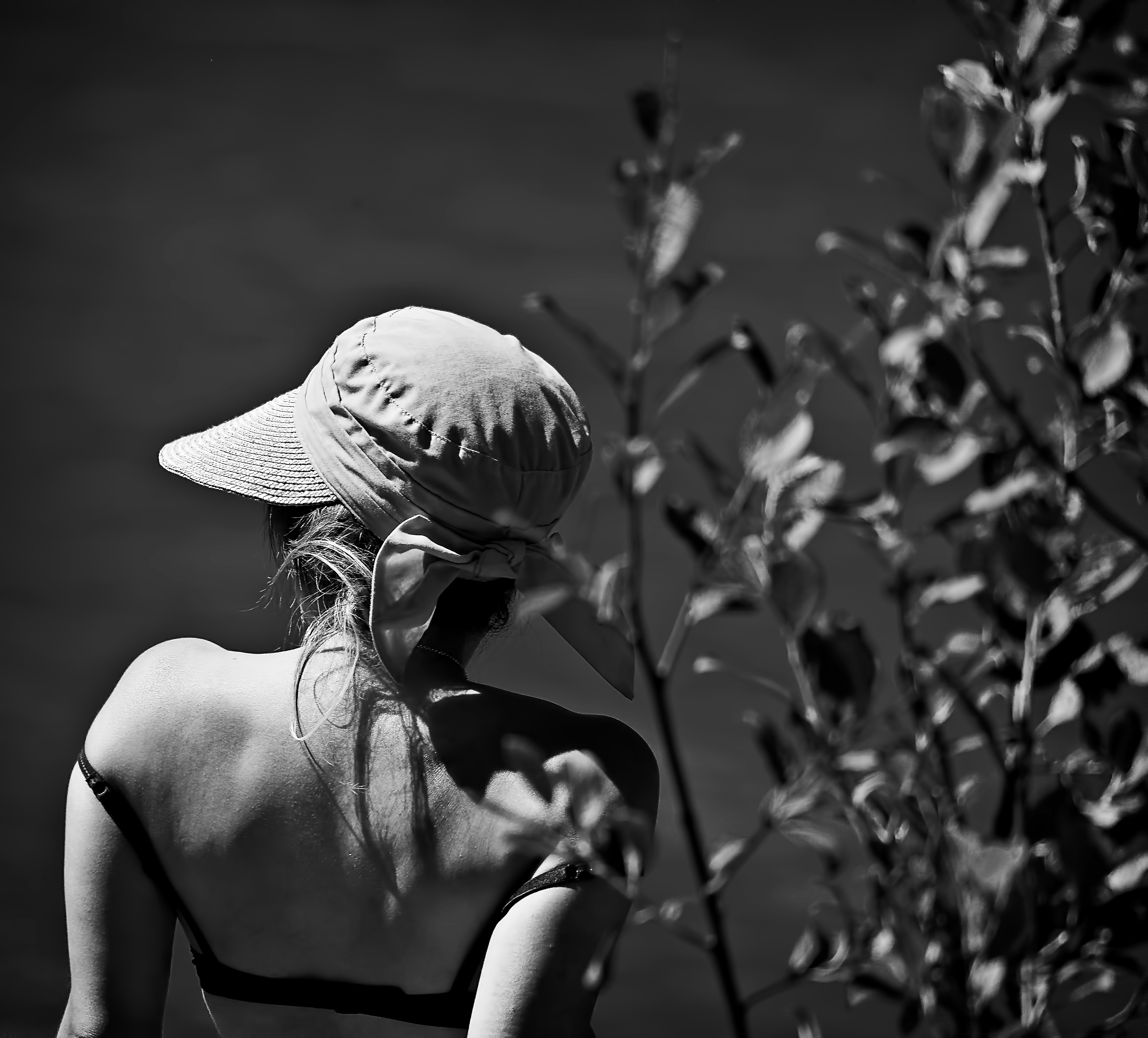 grayscale photography of woman wearing cap
